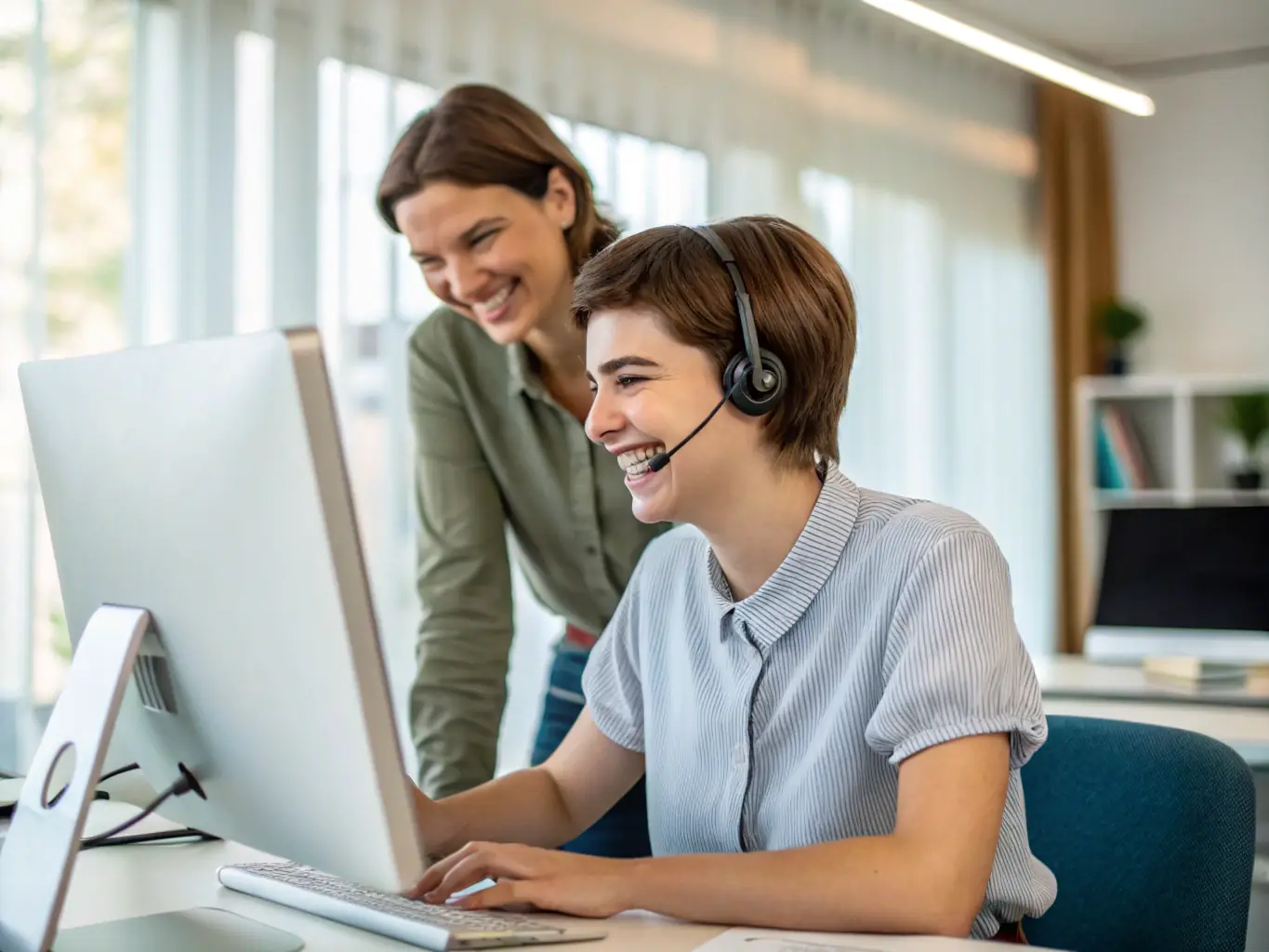 A friendly Divine Digital support team member assisting a church pastor with website updates on a laptop, showcasing personalized customer service.